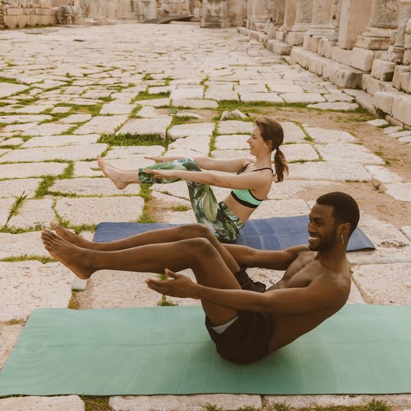 Diverse group of people smiling after a yoga session.